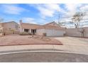 Lovely single-story home featuring a two-car garage and desert landscaping in front at 1163 Teal Point Dr, Henderson, NV 89074