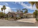 Spacious three-car garage and stone accents highlight the exterior at 1901 Rosemere Ct, Las Vegas, NV 89117