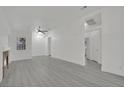 Bright living room with modern grey flooring, ceiling fan and natural light at 2218 Ramsgate Dr # 0, Henderson, NV 89074