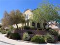Well-maintained two-story home with lush landscaping and a terraced front yard at 2461 Brooklyn Bridge St, Las Vegas, NV 89135