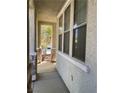Covered porch showcasing stone accents and a view of the landscaped yard at 2461 Brooklyn Bridge St, Las Vegas, NV 89135