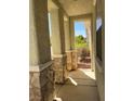 Inviting covered porch featuring stone-accented columns at 2461 Brooklyn Bridge St, Las Vegas, NV 89135