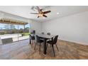 Bright dining room with a modern table set and view of the well maintained backyard at 2637 Rialto Rd, Las Vegas, NV 89108
