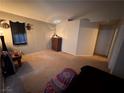 Cozy main bedroom features neutral walls, carpet and ample space for relaxation at 4841 Crystal Sword St, North Las Vegas, NV 89031