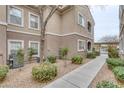A ground level exterior of a well maintained apartment building with shrubbery at 9330 W Maule Ave # 225, Las Vegas, NV 89148