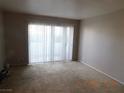 Carpeted living room with sliding glass doors for ample natural light at , Las Vegas, NV 89119