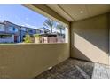 Enclosed outdoor patio space with brick flooring and neutral colored walls at 11439 Peak Landing Ave, Las Vegas, NV 89138