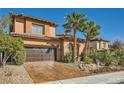 Charming two-story home showcases a two-car garage, meticulously maintained landscaping, and a warm, inviting facade at 12254 La Prada Pl, Las Vegas, NV 89138