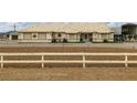 Charming single-story home featuring a well-kept yard and neutral colored exterior at 1550 Tiptop Trl, Pahrump, NV 89048