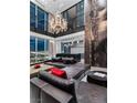 Spacious living room boasts a modern chandelier, large windows showcasing city views, and sleek, minimalist decor at 2700 Las Vegas Blvd # 4306, Las Vegas, NV 89109