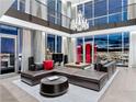 Bright living room featuring floor-to-ceiling windows, modern decor, a chandelier and a comfortable sectional sofa at 2700 Las Vegas Blvd # 4306, Las Vegas, NV 89109