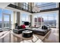 Elegant living room with floor-to-ceiling windows offering scenic city views and modern furnishings at 2700 Las Vegas Blvd # 4306, Las Vegas, NV 89109