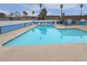 Large community pool with lounge chairs provides a perfect place to relax and enjoy the sun at 4666 Monterey Cir # 4, Las Vegas, NV 89169