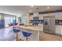 Modern kitchen featuring an island with stainless steel appliances at 4818 Lilac Ridge Ave # 28, Las Vegas, NV 89141
