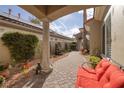 Inviting outdoor seating area with a stone water feature and beautiful greenery at 52 Via Paradiso St, Henderson, NV 89011