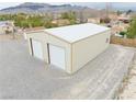 Large workshop with two garage doors and ample space for storage or projects at 620 W Leffner Dr, Pahrump, NV 89060