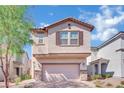 Inviting two-story home with a charming facade, complemented by a well-maintained front yard and mature tree at 6945 Trevelez St, Las Vegas, NV 89149