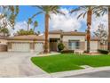 Charming single-story home with a three car garage, desert landscaping, and large paved driveway at 7816 Sandy Eagle Ct, Las Vegas, NV 89129