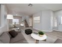 Open-concept living room and dining area, perfect for entertaining guests or relaxing with Gathering at 7836 Pinnochio Ave, Las Vegas, NV 89131