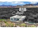 Aerial view of 818 Calluna Street highlighting a modern home, pool, and mountain views at 818 Calluna St, Las Vegas, NV 89138