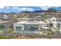 Beautiful backyard with a modern pool, patio, and mountain views in a luxurious community at 818 Calluna St, Las Vegas, NV 89138
