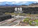 The Sandalwood Community entrance with beautiful landscaping and mountain views at 818 Calluna St, Las Vegas, NV 89138