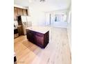 Open concept eat-in kitchen featuring an island with granite countertop and stainless appliances at 8628 Vondel Park St, Las Vegas, NV 89148