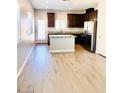 Eat-in kitchen with granite counters, stainless steel appliances, and a center island at 8628 Vondel Park St, Las Vegas, NV 89148