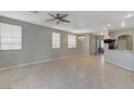 Open-concept living area with tile flooring, ample natural light, and seamless flow to the kitchen at 1004 Country Skies Ave, Las Vegas, NV 89123
