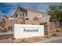 Welcoming community sign in a well-manicured landscape setting at 1066 Slate Crossing Ln # 3, Henderson, NV 89002