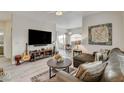 Cozy living room with a large TV, stylish furnishings, and an open layout at 1401 Red Crest Ln # 201, Las Vegas, NV 89144
