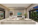 Open living room boasts a fireplace with stone surround and expansive sliding glass doors at 2630 Juniper Branch St, Las Vegas, NV 89117