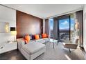 Modern living room with comfortable seating, city views, and stylish decor at 4381 W Flamingo Rd # 1903, Las Vegas, NV 89103