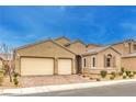 Charming single-story home featuring a two-car garage and desert landscaping at 8841 White Harbor Ave, Las Vegas, NV 89148
