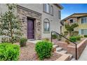 Charming front entrance with stone accents, landscaped garden, and a well-maintained walkway leading to the front door at 965 Nevada State Dr # 38202, Henderson, NV 89002