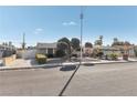 Attractive single-story home with well-manicured landscaping, two car garage, and inviting curb appeal at 1912 Parkchester Dr, Las Vegas, NV 89108