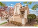Exterior view of a two-story home with desert landscaping and a tile roof at 2057 Wandering Doe Ln, Las Vegas, NV 89134