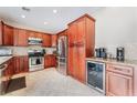 Gourmet kitchen with granite countertops and stainless steel appliances at 2057 Wandering Doe Ln, Las Vegas, NV 89134