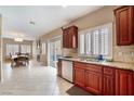 Open concept kitchen with granite countertops and stainless steel appliances at 2057 Wandering Doe Ln, Las Vegas, NV 89134