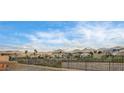 Scenic neighborhood view featuring well-maintained homes, mature landscaping, and mountain views in the background at 2516 Evansville Ave, Henderson, NV 89052