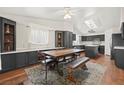 Eat-in kitchen featuring dark cabinetry, an island, and a skylight above the table at 274 Aztec Ln, Henderson, NV 89015