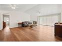 Spacious living room with hardwood floors, a fireplace, and lots of natural light at 274 Aztec Ln, Henderson, NV 89015
