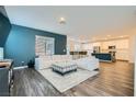 Inviting living space showcasing a comfortable white sectional sofa and open-concept design at 290 Mount Tyndall St, Henderson, NV 89015