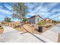 Corner lot features desert landscaping with benches for residents to enjoy the outdoors at 314 Meadow Brush Pl, Henderson, NV 89011