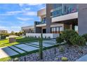Modern home with stylish desert landscaping and walkway at 3266 S Spring Mountain Blvd, Pahrump, NV 89048