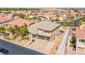 Expansive two-story home with a three-car garage, landscaped yard, and neutral-toned exterior at 4372 Melrose Abbey Pl, Las Vegas, NV 89141