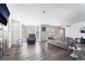 Spacious living room boasts wood flooring, fireplace, neutral paint and lots of natural light at 5272 Blanton Dr, Las Vegas, NV 89122