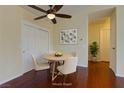 Dining room with hardwood floors, a ceiling fan, a round table, and four chairs at 5345 Silvermist Ct # 203, Las Vegas, NV 89122