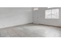 Bright living room with tile floors, a front door and plenty of space at 5784 Dew Mist Ln, Las Vegas, NV 89110
