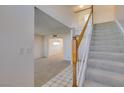 Entryway with staircase and view into carpeted living room at 637 Otono Dr, Boulder City, NV 89005